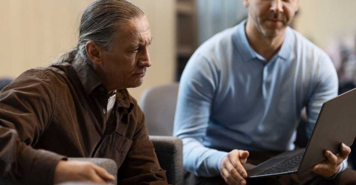 Someone getting assistance with a laptop